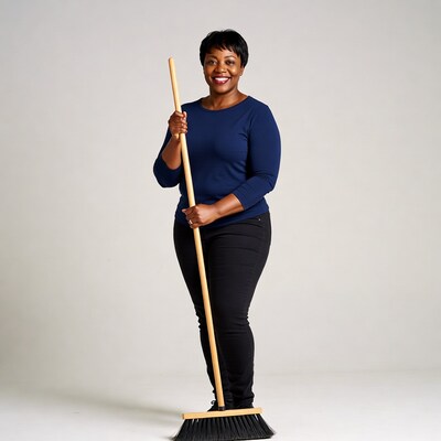 African-American woman holding broom