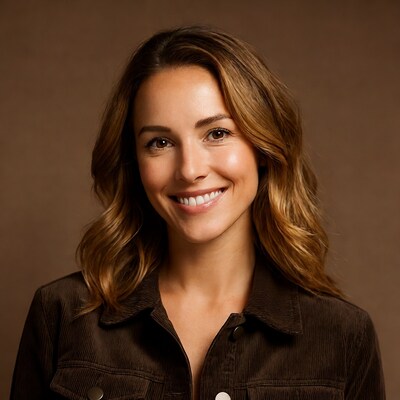Smiling woman in brown corduroy jacket