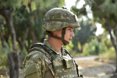 Soldier in camouflage helmet profile view