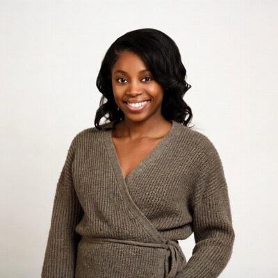 Smiling African-American woman in brown wrap dress