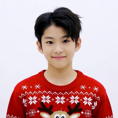 Asian boy in reindeer Christmas sweater