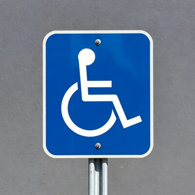 Blue wheelchair accessibility sign