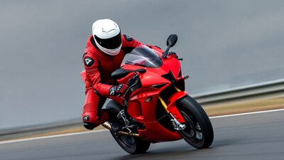 Rider on red sport motorcycle speeding