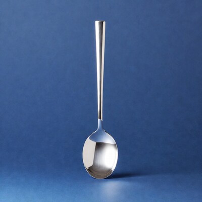 Silver spoon on blue background