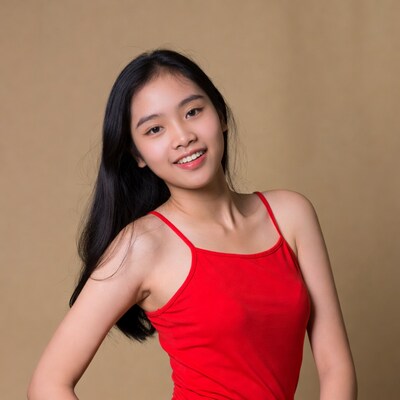 Asian girl smiling in red tank top