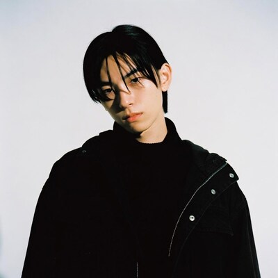 Asian man in black hoodie