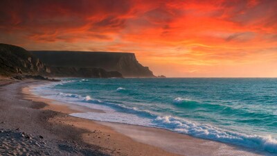 Dramatic Sunset Beach with Cliffs
