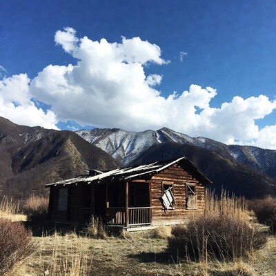 Abandoned Cabin in Snowy Mountains