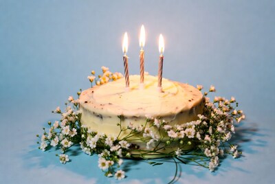 Birthday cake with lit candles