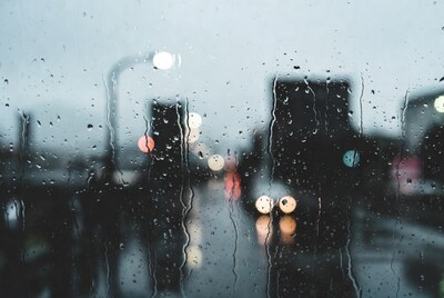 Rainy city lights through window