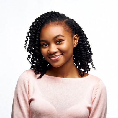 Smiling African-American girl in pink sweater