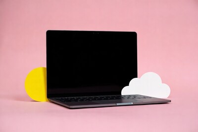 Laptop with yellow circle and cloud