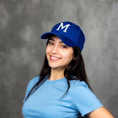 Asian woman smiling in blue M cap
