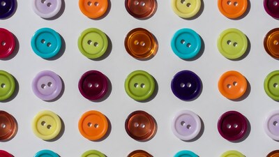 Colorful buttons arranged on white background