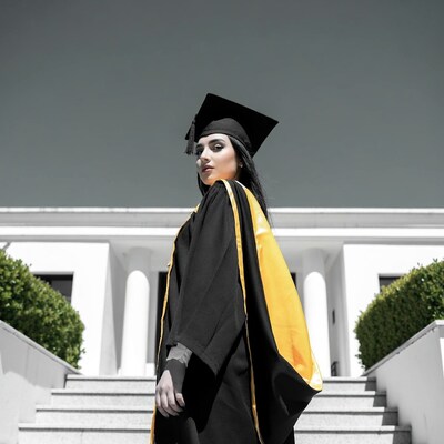 Middle Eastern woman in graduation gown