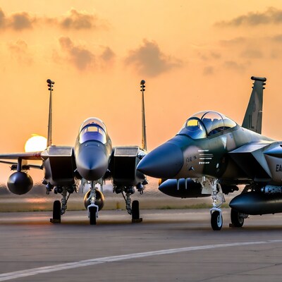 F-15 fighter jets at sunset