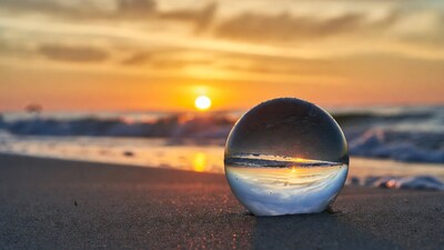 Glass Sphere Capturing Beach Sunset