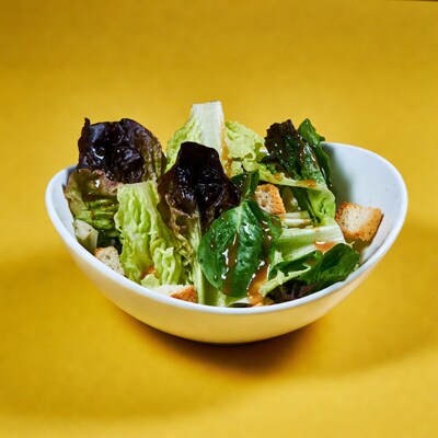 Fresh salad in white bowl