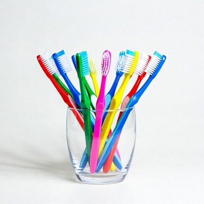 Colorful toothbrushes in glass