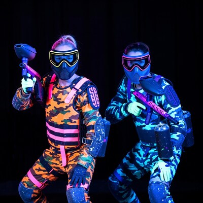 Two women in neon paintball gear