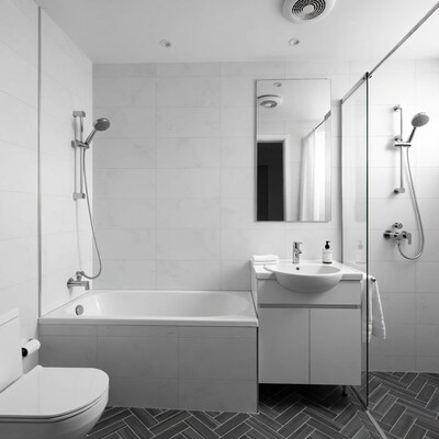 Modern white bathroom with bathtub shower