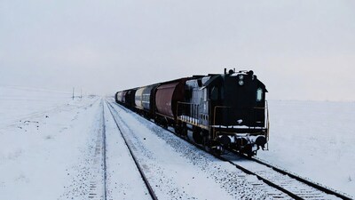Freight train on snowy tracks