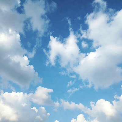 Fluffy Clouds in Blue Sky