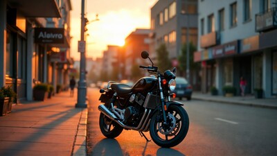 Black motorcycle parked on sunset street