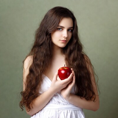 Girl holding red apple