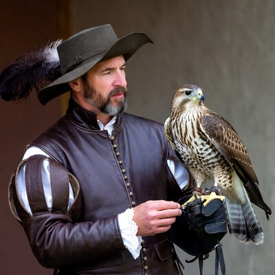 Man holding falcon in Renaissance costume