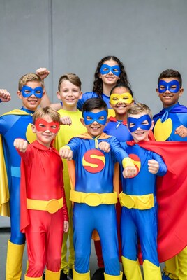 Group of kids in superhero costumes
