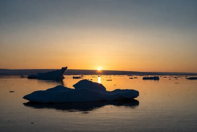 Icebergs in sunset over Arctic sea