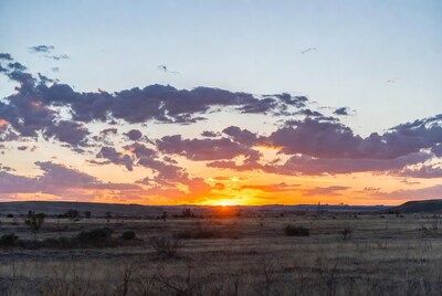 Sunset over vast desert landscape