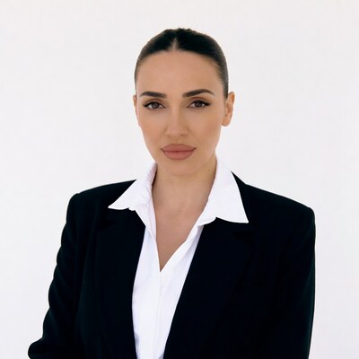 Woman in black blazer white shirt