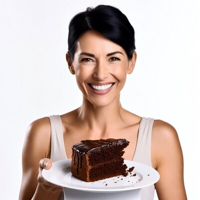 Woman holding chocolate cake slice