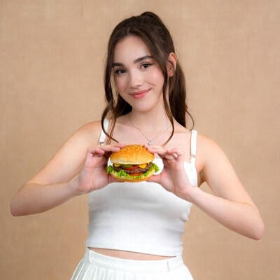 Girl holding burger