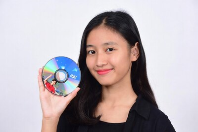 Asian woman holding DVD disc