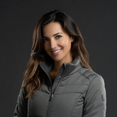 Smiling woman in gray puffer jacket