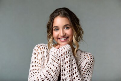 Smiling woman in knit sweater