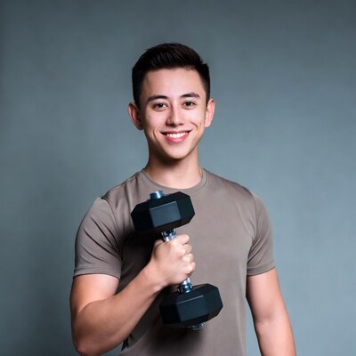 Asian man holding dumbbell