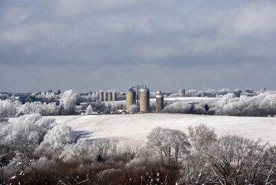 Snowy Grain Silos in Winter Landscape