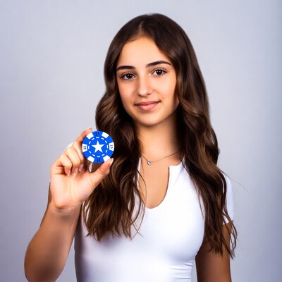Girl holding blue 21 poker chip