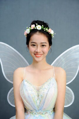 Asian woman in fairy costume with wings