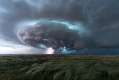 Supercell thunderstorm lightning over grassland