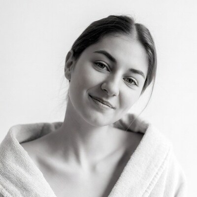 Smiling woman in bathrobe