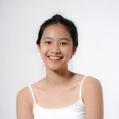 Smiling Asian girl in white camisole