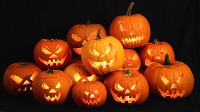 Jack-o-lantern pumpkins on black background