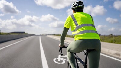 Cyclist in hi-vis vest on bike lane