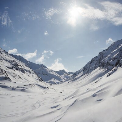 Snowy Mountain Valley with Sun