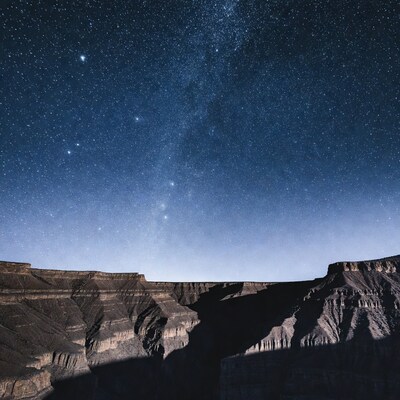 Milky Way over canyon cliffs